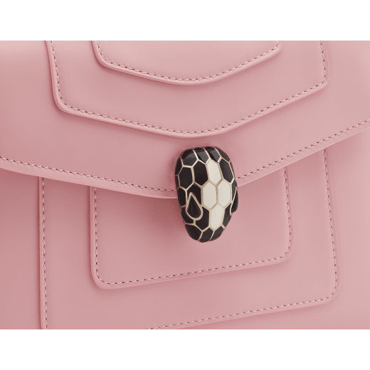 Serpenti Forever small crossbody bag in primrose quartz pink calf leather with heather amethyst pink grosgrain lining. Captivating snakehead magnetic closure in light gold-plated brass embellished with black and white agate enamel scales and black onyx eyes. 422-CLb image 5