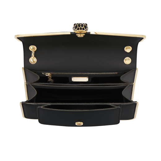 Serpenti Forever medium shoulder bag in black Metropolitan calf leather with light gold-plated brass frames and black nappa leather lining. Captivating snakehead magnetic closure in light gold-plated brass embellished with black enamel scales, and black onyx eyes. 1077-MF image 4