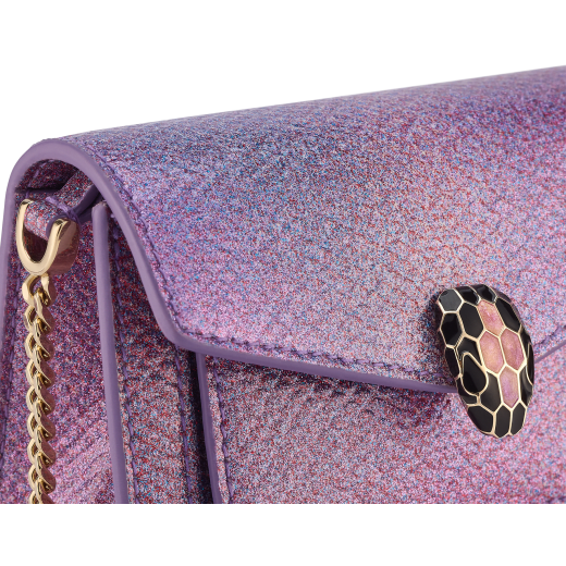 Serpenti Forever micro bag in sheer amethyst lilac Gleamy karung skin with primrose quartz pink nappa leather interior. Captivating magnetic snakehead closure in light gold-plated brass embellished with red enamel eyes. 292934 image 4