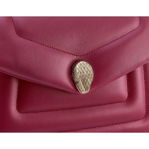 Serpenti Reverse small shoulder bag in ivory opal quilted Metropolitan calf leather with black nappa leather lining. Captivating snakehead magnetic closure in gold-plated brass embellished with red enamel eyes. 1244-MCL image 5