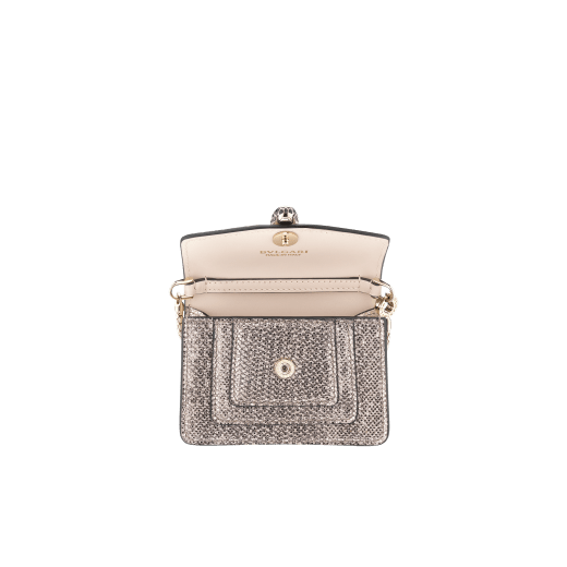 Bag charm Serpenti Forever miniature in milky opal metallic karung skin, with sea star coral calf leather lining. Iconic brass light gold plated snakehead stud closure enameled in black and glitter milky opal and finished with black enamel eyes. SERP-BAG-CHARM-MK image 2