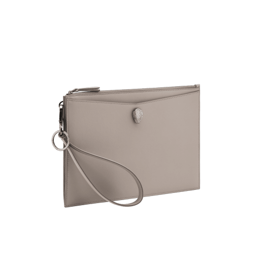 Serpenti Forever pouch in black calf leather with black nappa leather interior. Captivating snakehead rivet in dark ruthenium-plated brass embellished with red enamel eyes. SEA-UNIPOUCH-CL image 6