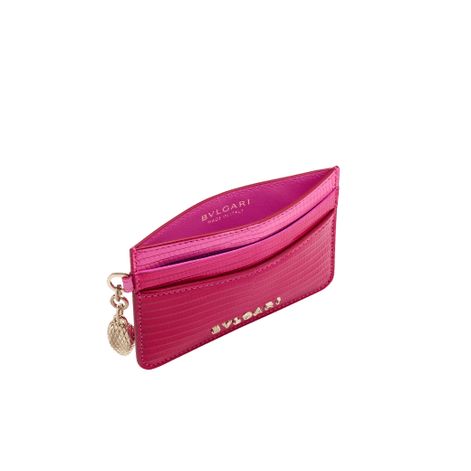 Serpenti Forever card holder in beetroot spinel fuchsia dégradé lizard skin. Captivating snakehead charm in light gold-plated brass embellished with red enamel eyes. 292287 image 2