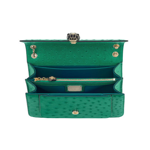 Serpenti Forever medium shoulder bag in vivid emerald green shiny ostrich skin with emerald green nappa leather lining. Captivating snakehead magnetic closure in light gold-plated brass embellished with black enamel and light gold-plated brass scales and black onyx eyes. 293263 image 4