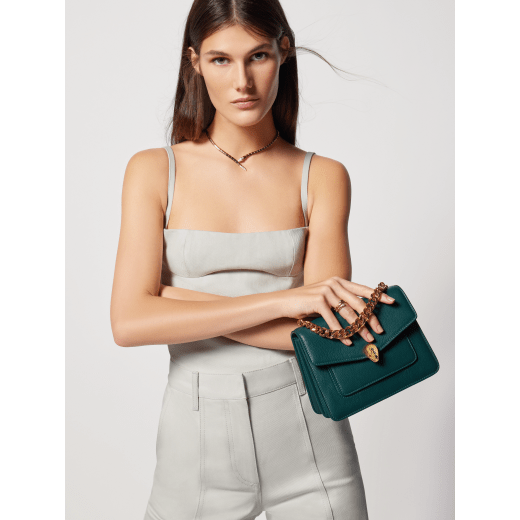 Serpenti Forever Maxi Chain small crossbody bag in flash diamond white grained calf leather with foggy opal grey nappa leather lining. Captivating snakehead magnetic closure in gold-plated brass embellished with white mother-of-pearl scales and red enamel eyes. 1134-MCGC image 3