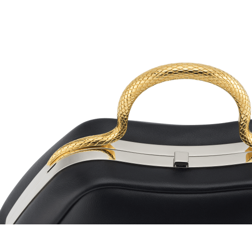 Serpentine mini top handle bag in black smooth calf leather with emerald green nappa leather lining. Captivating snake body-shaped top handle in gold-plated brass embellished with engraved scales and red enamel eyes, press-button closure and light gold-plated brass hardware. SRN-1291 image 6