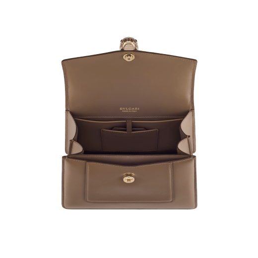 Serpenti Forever medium top handle bag in emerald green calf leather with black nappa leather lining. Captivating snakehead magnetic closure in light gold-plated brass embellished with deep jade intense green enamel and light gold-plated brass scales, and black onyx eyes. SEA-1282-CL image 4