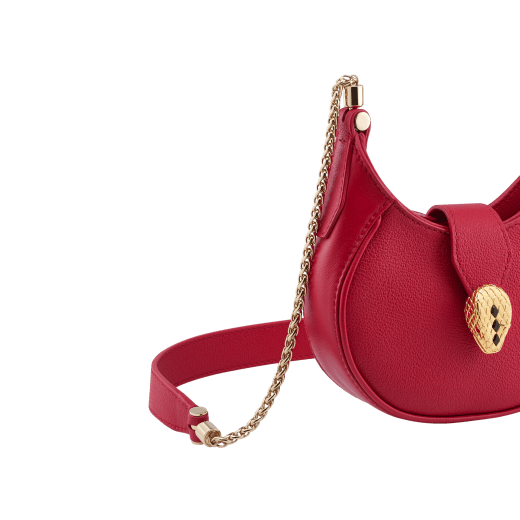 Serpenti Ellipse micro crossbody bag in soft drummed and smooth flamingo quartz pink calf leather with flamingo quartz pink gros grain lining. Captivating snakehead closure in gold-plated brass embellished with red enamel eyes. Online exclusive colour. SEA-MICROHOBOb image 5