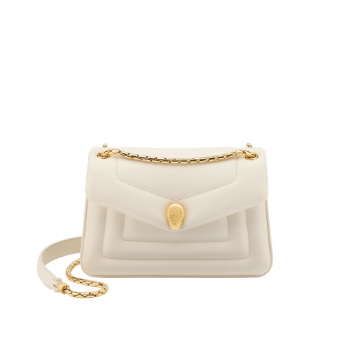 Serpenti Reverse small shoulder bag in ivory opal quilted Metropolitan calf leather with black nappa leather lining. Captivating snakehead magnetic closure in gold-plated brass embellished with red enamel eyes. 1244-MCL image 1