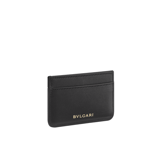 Serpenti Cabochon card holder in black calf leather with maxi matelassé pattern. Captivating snakehead rivet in gold-plated brass embellished with red enamel eyes. SCB-CCHOLDER image 3