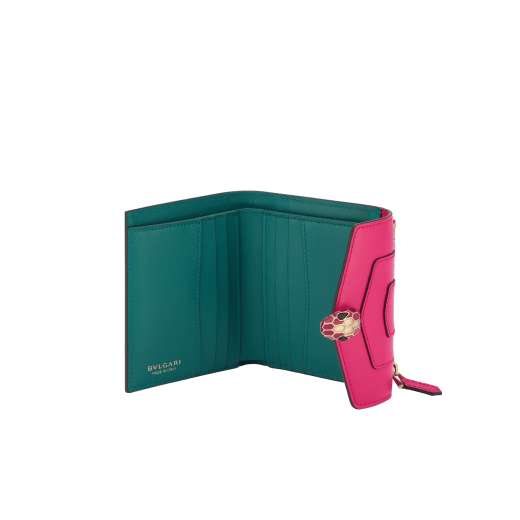 Serpenti Forever compact wallet in emerald green calf leather with violet amethyst nappa leather interior. Captivating snakehead press button closure in light gold-plated brass embellished with black and white agate enamel scales and green malachite eyes. SEA-WLT3FOLDCOMPb image 2