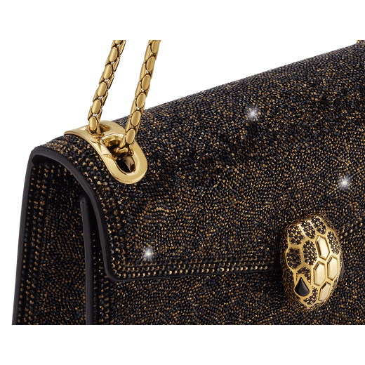 Serpenti Forever Day-to-Night small shoulder bag with black crystals inserts hand-set on suede leather with black nappa leather lining. Captivating snakehead magnetic closure in gold-plated brass embellished with black zirconia pavé and gold-plated brass scales, and black onyx eyes. 294042 image 5