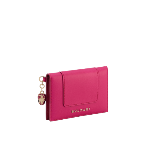 Serpenti Forever Special Resort Edition folded card holder in coral carnelian orange calf leather with beetroot spinel fuchsia nappa leather interior. Captivating snakehead charm embellished with red enamel eyes and a palm charm, both in light gold-plated brass, and press button closure. SEA-CC-HOLDER-FOLD-Clb image 1