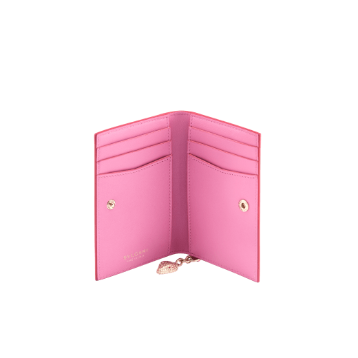 Serpenti Forever folded card holder in coral carnelian orange calf leather with flamingo quartz pink nappa leather interior. Captivating light gold-plated brass snakehead charm with red enamel eyes, and press-stud closure. SEA-CC-HOLDER-FOLD-Cla image 2