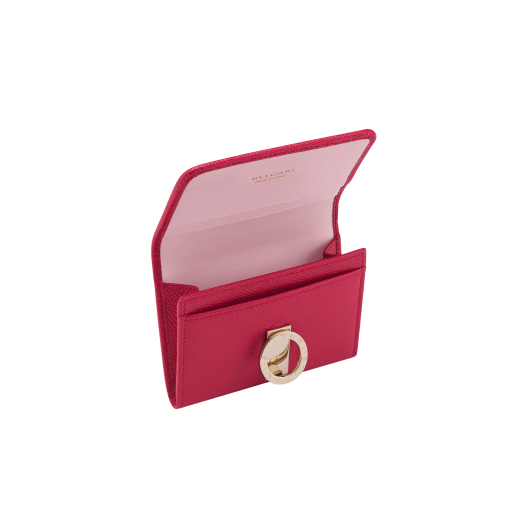 Business card holder in ruby red bright grain calf leather, desert quartz nappa and fuxia nappa lining. Iconic brass light gold plated clip featuring the BVLGARI BVLGARI motif. 579-BC-HOLDER-BGCLa image 2