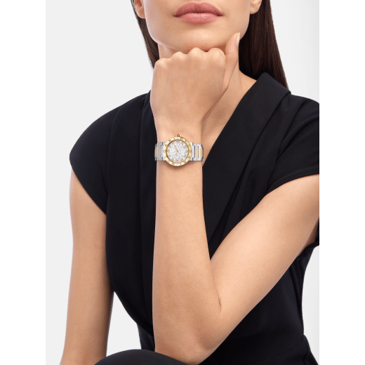 Bvlgari Bvlgari watch in 18 kt yellow gold and polished and satin-brushed stainless steel, double logo engraving on the bezel, white mother-of-pearl dial and 12 diamond indexes. Water-resistant up to 30 metres 104278 image 1