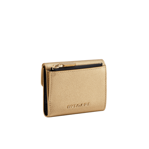 "Serpenti Forever" slim compact wallet in black calf leather and black goatskin. Iconic light gold plated brass snakehead stud closure in black enamel, with black onyx eyes. SEA-SLIMCOMPACT-Cla image 3