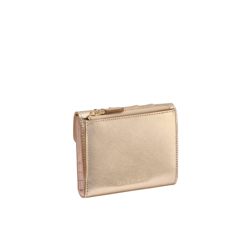 Serpenti Forever compact wallet in emerald green calf leather with violet amethyst nappa leather interior. Captivating snakehead press button closure in light gold-plated brass embellished with black and white agate enamel scales and green malachite eyes. SEA-WLT3FOLDCOMPb image 3