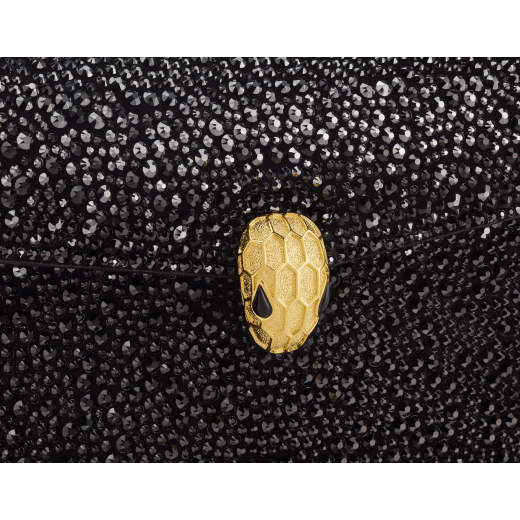 Serpenti Forever mini crossbody bag in natural suede with different-size gold crystals and black nappa leather lining. Captivating magnetic snakehead closure in gold-plated brass embellished with "diamantatura" engraving on the scales and black onyx eyes. 986-CDS image 5
