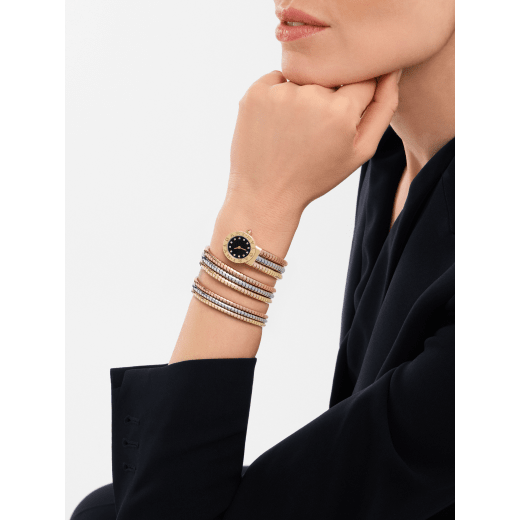 Bvlgari Bvlgari Tubogas watch with 18 kt yellow gold case and double logo engraving on the bezel, black lacquered dial, diamond indexes, and double-spiral mini Tubogas bracelet in 18 kt yellow, white and rose gold. Water-resistant up to 50 metres. 103776 image 1