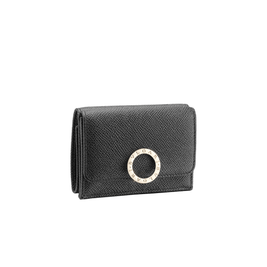 "BVLGARI BVLGARI" compact wallet in Caramel Topaz beige bright grain calf leather and Zephyr Quartz pink soft nappa leather. Iconic logo clip closure in gold plated brass on the flap and a press stud closure on the body. 579-MINICOMPACTa image 1