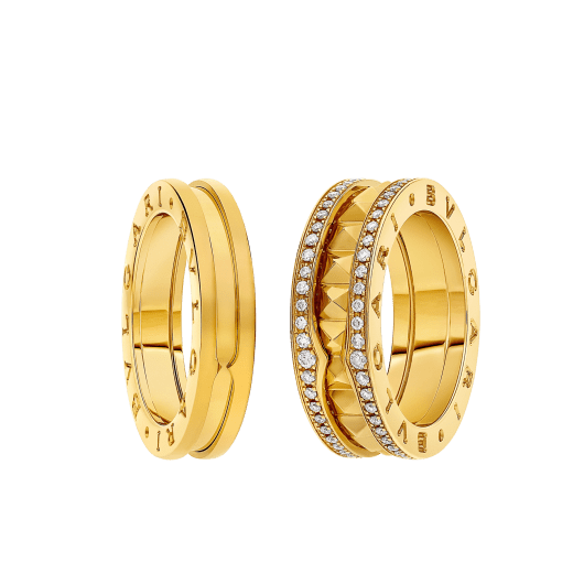B.zero1 and B.zero1 Rock couple rings in 18 kt yellow gold, one of which has studded spiral and pavé diamonds on the edges. A timeless ring set fusing visionary design with bold charisma. BZERO1-COUPLES-RINGS-6 image 1