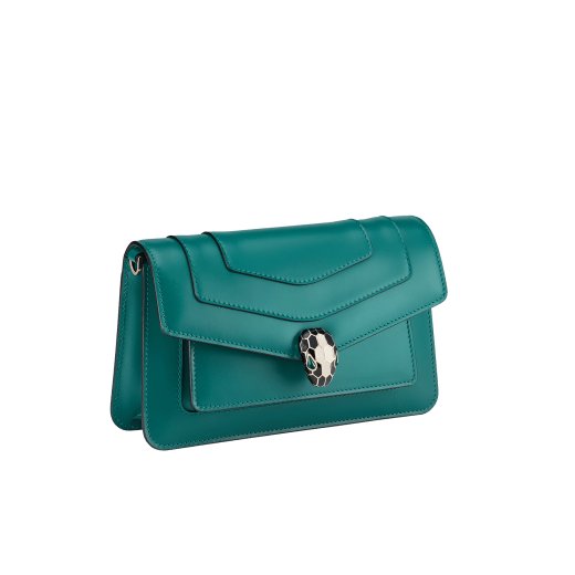 Serpenti Forever East-West small shoulder bag in black calf leather with emerald green gros grain lining. Captivating snakehead magnetic closure in light gold-plated brass embellished with black and white agate enamel scales, and green malachite eyes. 1237-CL image 2