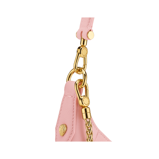 Serpenti Ellipse small crossbody bag in Urban grain and smooth ivory opal calf leather with flamingo quartz pink gros grain lining. Captivating snakehead closure in gold-plated brass embellished with black onyx scales and red enamel eyes. 1204-UCLa image 5