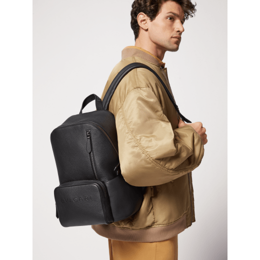 BULGARI Man large backpack in black smooth and grainy metal-free calf leather with Olympian sapphire blue regenerated nylon (ECONYL®) lining. Dark ruthenium-plated brass hardware, hot stamped BULGARI logo and zipped closure. BMA-1212-CL image 7
