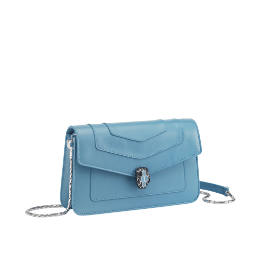 Serpenti Forever chain wallet in Niagara sapphire blue calf leather with silky coral pink nappa leather interior. Captivating palladium-plated brass snakehead magnetic closure embellished with black and Niagara sapphire blue enamel scales and black onyx eyes. SEA-CHAINPOCHETTE-LCL image 1