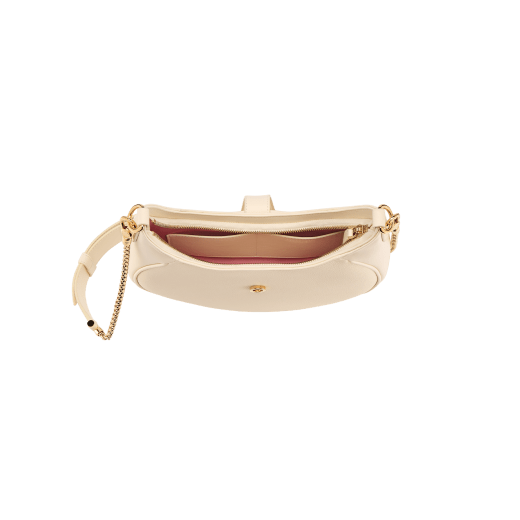 Serpenti Ellipse medium shoulder bag in Urban grain and smooth ivory opal calf leather with flamingo quartz pink grosgrain lining. Captivating snakehead closure in gold-plated brass embellished with black onyx scales and red enamel eyes. 1190-UCL image 8