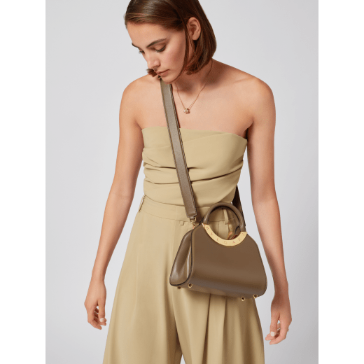 Bvlgari Roma small top handle bag in black Metropolitan calf leather with black nappa leather lining. Iconic metal detail in antique gold-plated brass engraved with the Bvlgari logo, and press button closure. BVR-001-1270S image 2