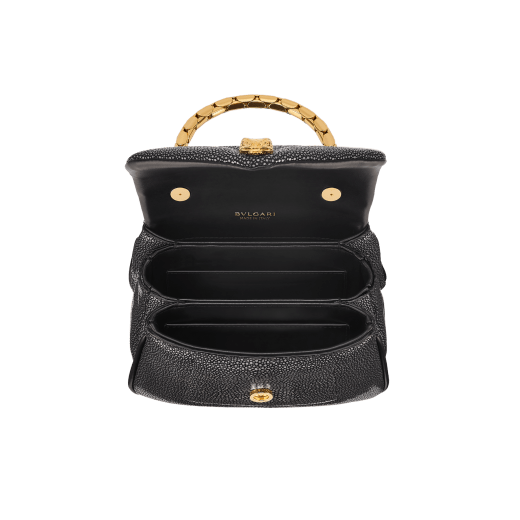 Serpenti Reverse small top handle bag in soft emerald green galuchat skin with amethyst purple nappa leather lining. Captivating magnetic snakehead closure in light gold-plated brass embellished with red enamel eyes. 1234-SG image 4