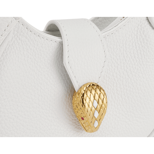 Serpenti Ellipse micro bag in soft, drummed, flash diamond white calf leather with taffy quartz pink grosgrain lining. Captivating snakehead closure in gold-plated brass embellished with mother-of-pearl scales and red enamel eyes, leather tab with magnet, and zipped fastening. SEA-MICROHOBOc image 4