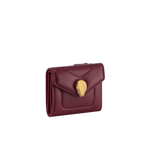 Serpenti Reverse compact wallet in Sahara amber light brown quilted Metropolitan calf leather with taffy quartz pink Metropolitan calf leather interior. Captivating snakehead press button closure in gold-plated brass embellished with red enamel eyes. SRV-COMPACTWLT image 1