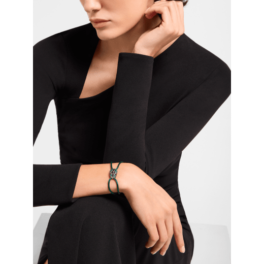 "Serpenti Forever" bracelet in Midnight Sapphire blue fabric with an alluring snakehead décor in light gold-plated brass enamelled in black and glittery Hawk's Eye grey, with seductive black enamel eyes. SERP-STRINGd image 2