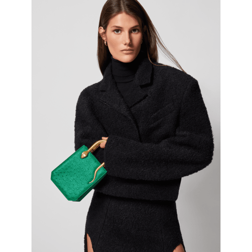 Serpentine mini tote bag in vivid emerald green shiny ostrich skin with vivid emerald green nappa leather lining. Captivating snake body-shaped handles in gold-plated brass embellished with engraved scales and red enamel eyes. 293262 image 1