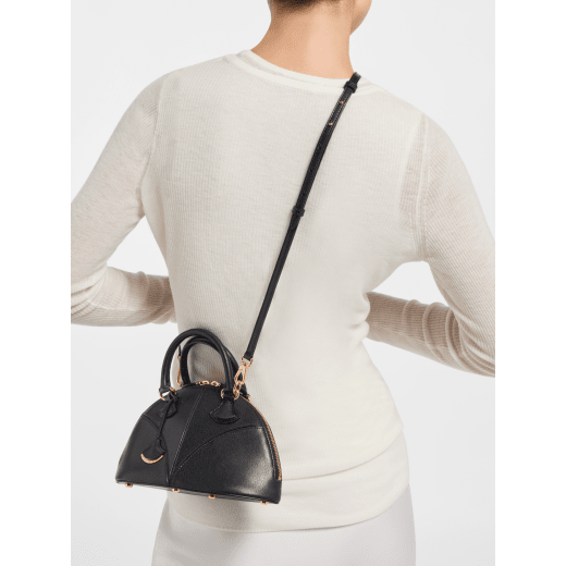 Marquise small top handle bag in black goat leather with black nappa leather lining and zipped closure. Detachable signature black goat leather charm with mirror. DAS-001-1325S image 1