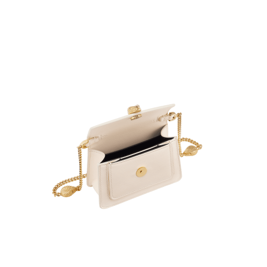 Serpenti Forever micro bag in amaranth garnet red calf leather. Captivating snakehead closure in light gold-plated brass embellished with red enamel eyes. SEA-MICROXBODY image 2