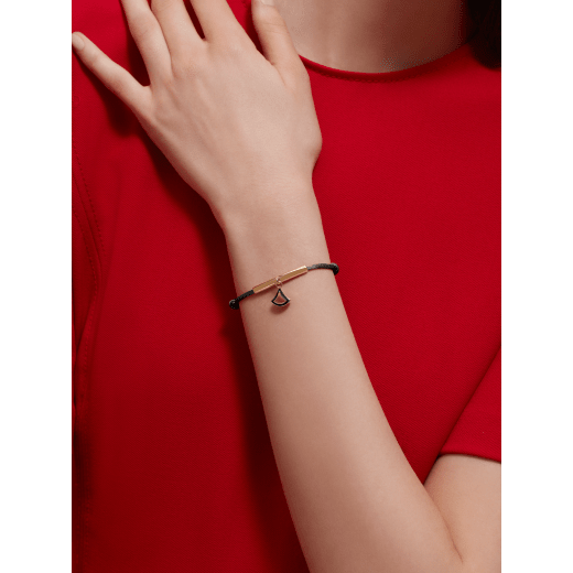 Divas’ Dream bracelet in ruby red fabric. Gold-plated brass tubular element with refined charm embellished with ruby red enamel. DIVAMINISTRINGa image 1