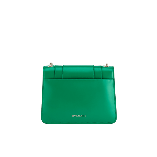 Serpenti Forever small crossbody bag in vivid emerald green calf leather with beet amethyst fuchsia grosgrain lining. Captivating snakehead magnetic closure in light gold-plated brass embellished with bright forest emerald green enamel and light gold-plated brass scales, and black onyx eyes. 422-CLc image 3
