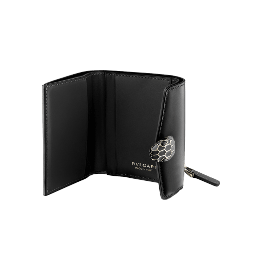 Serpenti Forever slim compact wallet in emerald green calf leather with black nappa leather interior. Captivating snakehead press button closure in light gold-plated brass embellished with black and white agate enamel scales and black onyx eyes. SEA-SLIMCOMPACT-Clb image 2