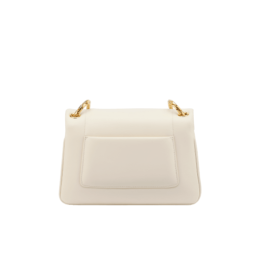 Serpenti Reverse small shoulder bag in ivory opal quilted Metropolitan calf leather with black nappa leather lining. Captivating snakehead magnetic closure in gold-plated brass embellished with red enamel eyes. 1244-MCL image 3