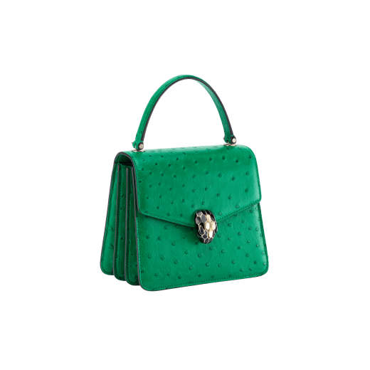 Serpenti Forever small top handle bag in vivid emerald green shiny ostrich skin with emerald green nappa leather lining. Captivating snakehead magnetic closure in light gold-plated brass embellished with black enamel and light gold-plated brass scales, and black onyx eyes. 293264 image 2