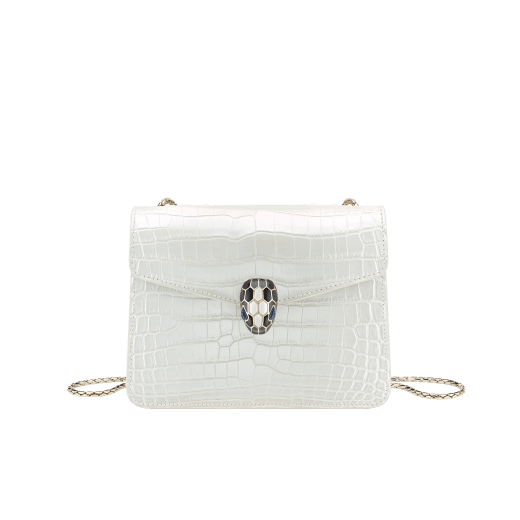 “Serpenti Forever” crossbody bag in white agate crocodile skin with an iridescent and pearled effect. Iconic snake head closure in light gold plated brass enriched with black enamel and mother-of-pearl scales, and blue lapis lazuli eyes. 422-CR image 1