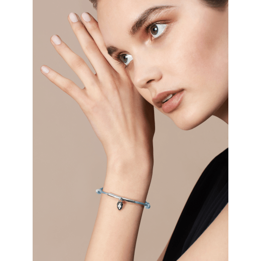 "Serpenti Forever" bracelet in Rose Gold pink fabric, with a gold-plated brass plate. Iconic snakehead charm enamelled in black and white agate, with seductive black enamel eyes. SERP-MINISTRINGa image 1
