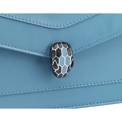 Serpenti Forever chain wallet in Niagara sapphire blue calf leather with silky coral pink nappa leather interior. Captivating palladium-plated brass snakehead magnetic closure embellished with black and Niagara sapphire blue enamel scales and black onyx eyes. SEA-CHAINPOCHETTE-LCL image 4