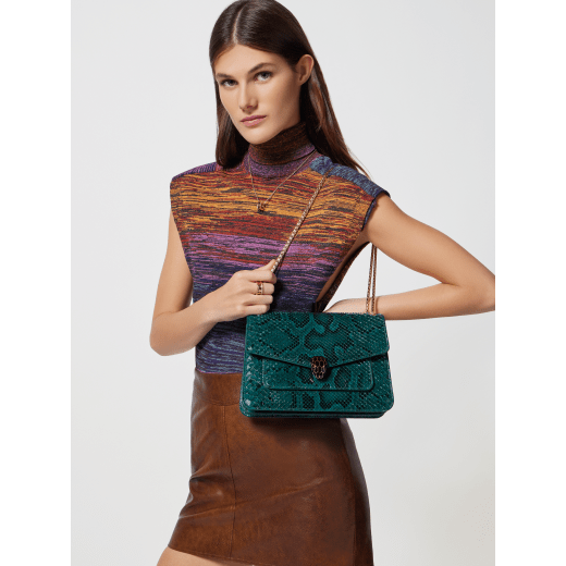 Serpenti Forever medium shoulder bag in Forest Emerald green shiny python skin with black nappa leather lining. Captivating snakehead press button closure in gold-plated brass embellished with black enamel scales, and black onyx eyes. 292580 image 6