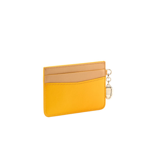 Serpenti Forever card holder in gold Urban grain calf leather. Captivating snakehead charm in light gold-plated brass embellished with red enamel eyes. SEA-CC-HOLDER-CLa image 3