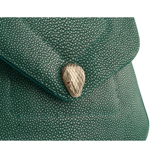 Serpenti Reverse small top handle bag in soft emerald green galuchat skin with amethyst purple nappa leather lining. Captivating magnetic snakehead closure in light gold-plated brass embellished with red enamel eyes. 1234-SG image 6